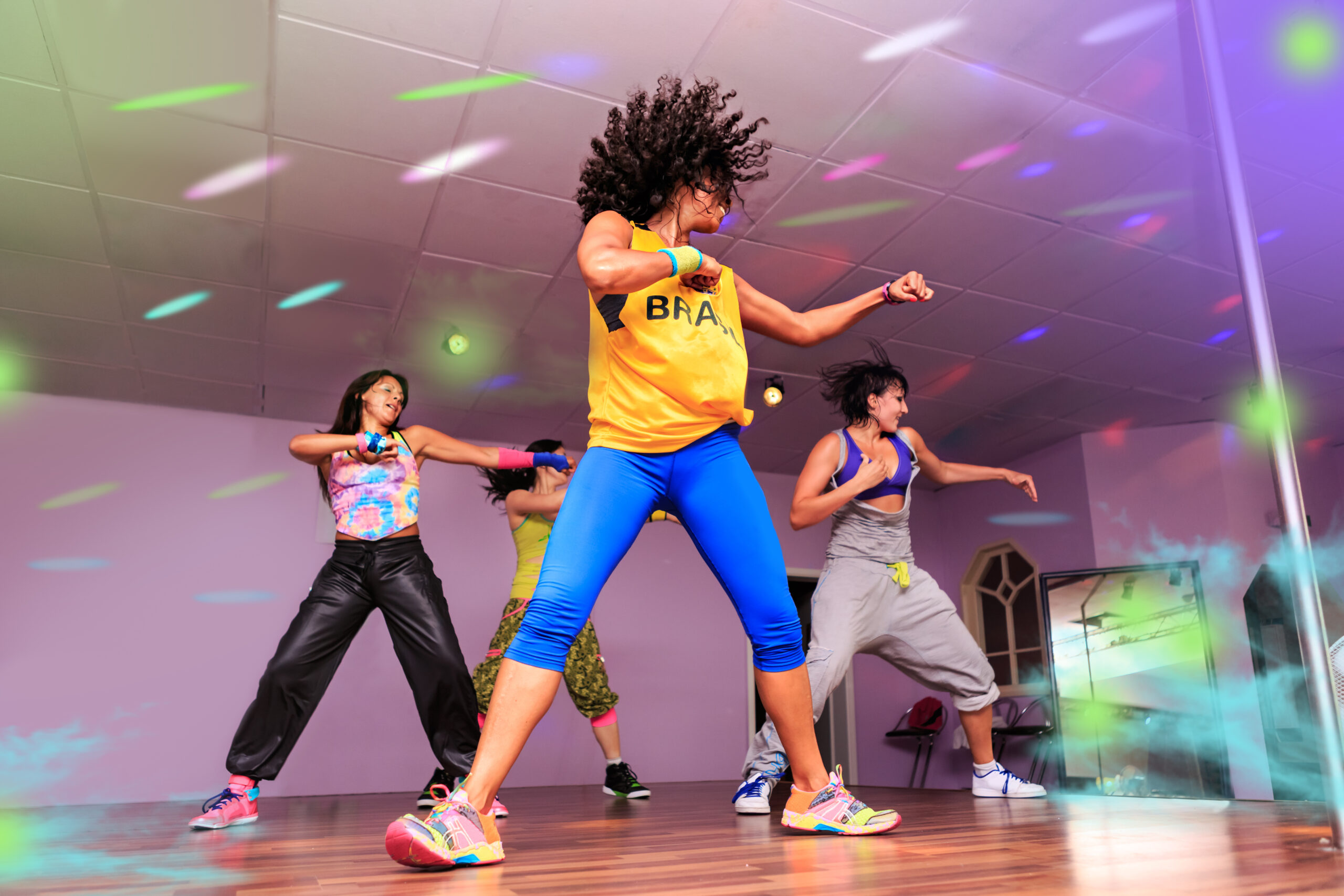 young women in sport dress at an aerobic or zumba exercise